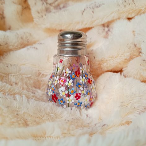 Kwiecista solniczka szklana wysokość 7 cm.