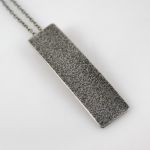 Piasek - metalowy wisiorek (2311-09) - W kolorze srebra