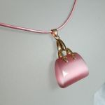 Różowy kwarc "kocie oko" - wisiorek torebka na rzemyku - 