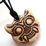 Tybetańska maska, talizman, wisior na rzemieniu - 