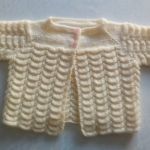 Sweterek kremowy - newborn