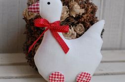 Biała gąska na kraciastych "wrotkach"