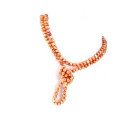 Pomarańczowe, naturalne perły, długi sznur pereł, naszynik