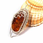 Bursztyn, Srebrny wisior z bursztynem żółty - amulet z bursztynem