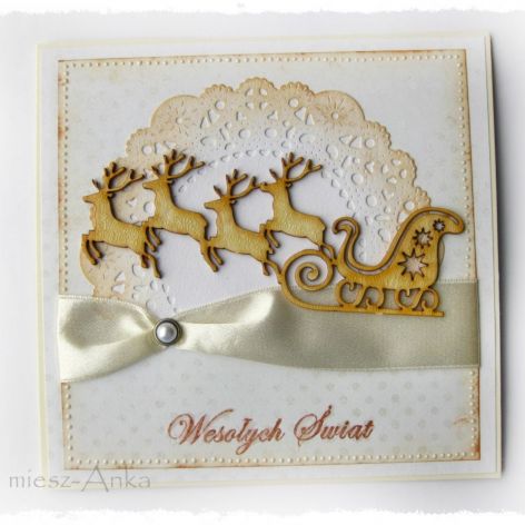 Kartka świąteczna z saniami i reniferami